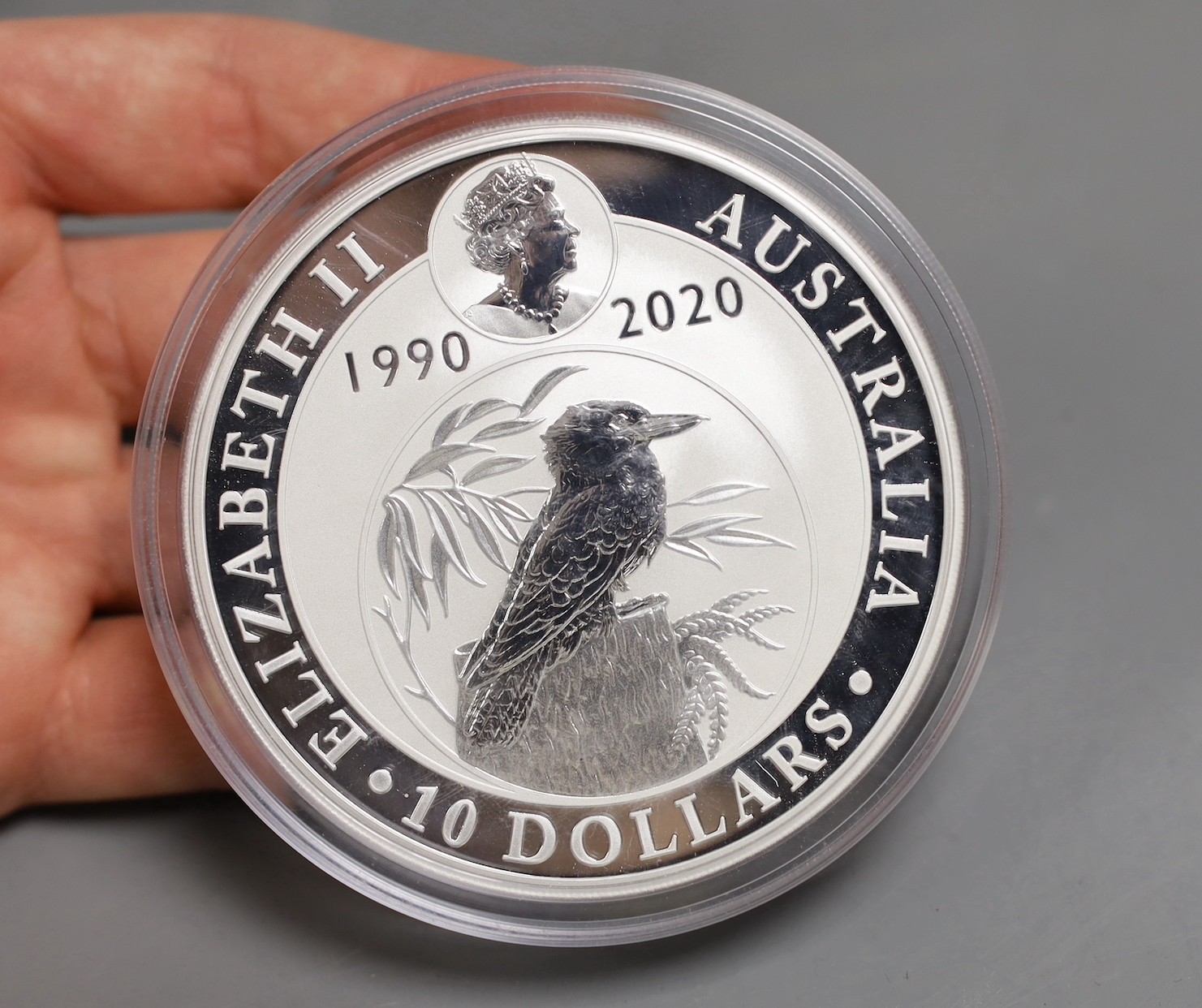 A Back to the Future DeLorean silver coin and model car set and an Australia mint 10oz bullion silver $10